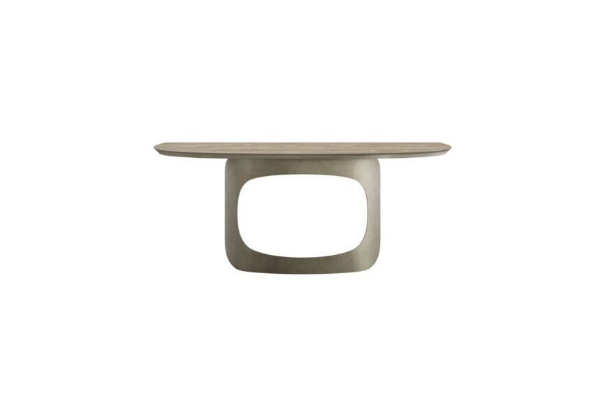 La console EMILY Miroir est une console moderne et minimaliste dotée d'un plateau en bois ovale et lisse soutenu par une base sculpturale et abstraite. Son design ouvert crée un vide visuel qui contraste avec l'aspect solide du plateau de table. La table est présentée sur un fond blanc. Meubles Barret Bordeaux
